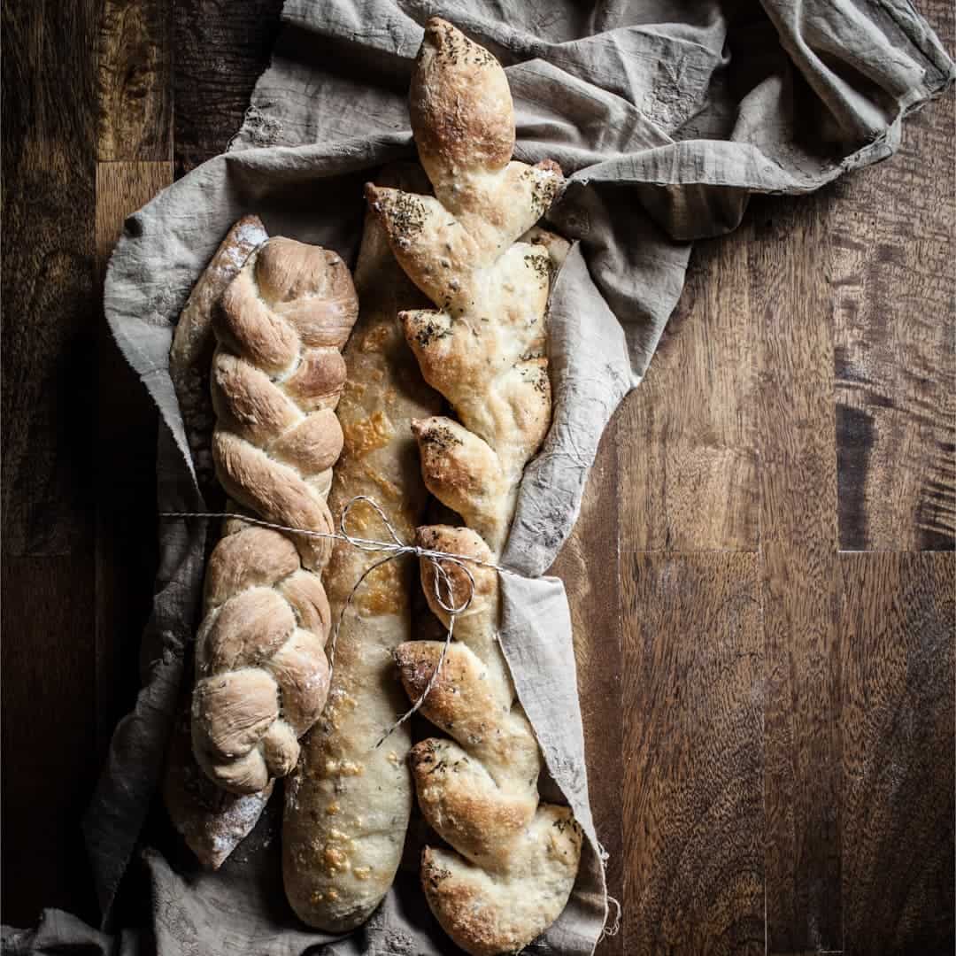 three loaves of bread in a rustic cloth