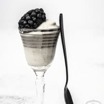 Black & White Appetizer Recipes | Vanilla Custard with Blackberries in little dessert glass with spoon leaning against it.