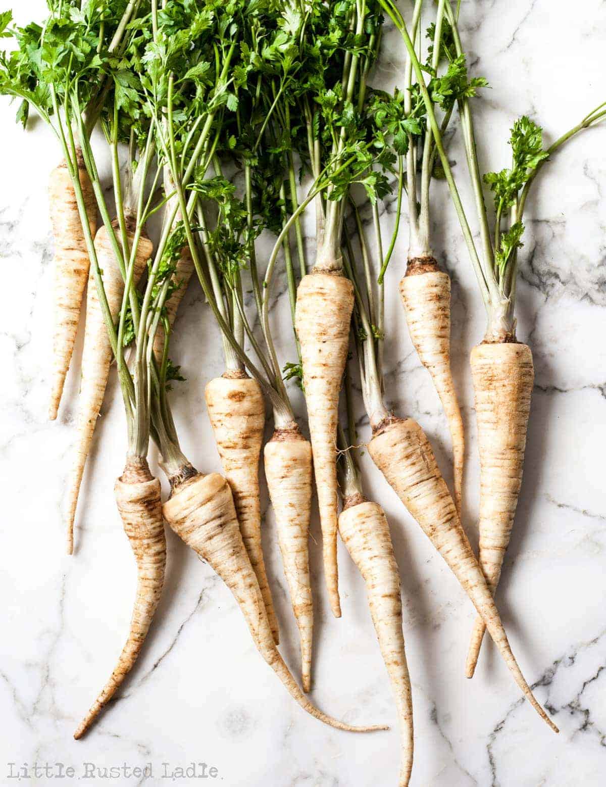 parsnips on white marble