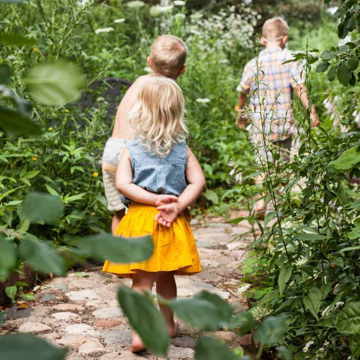 kids going through a garden path