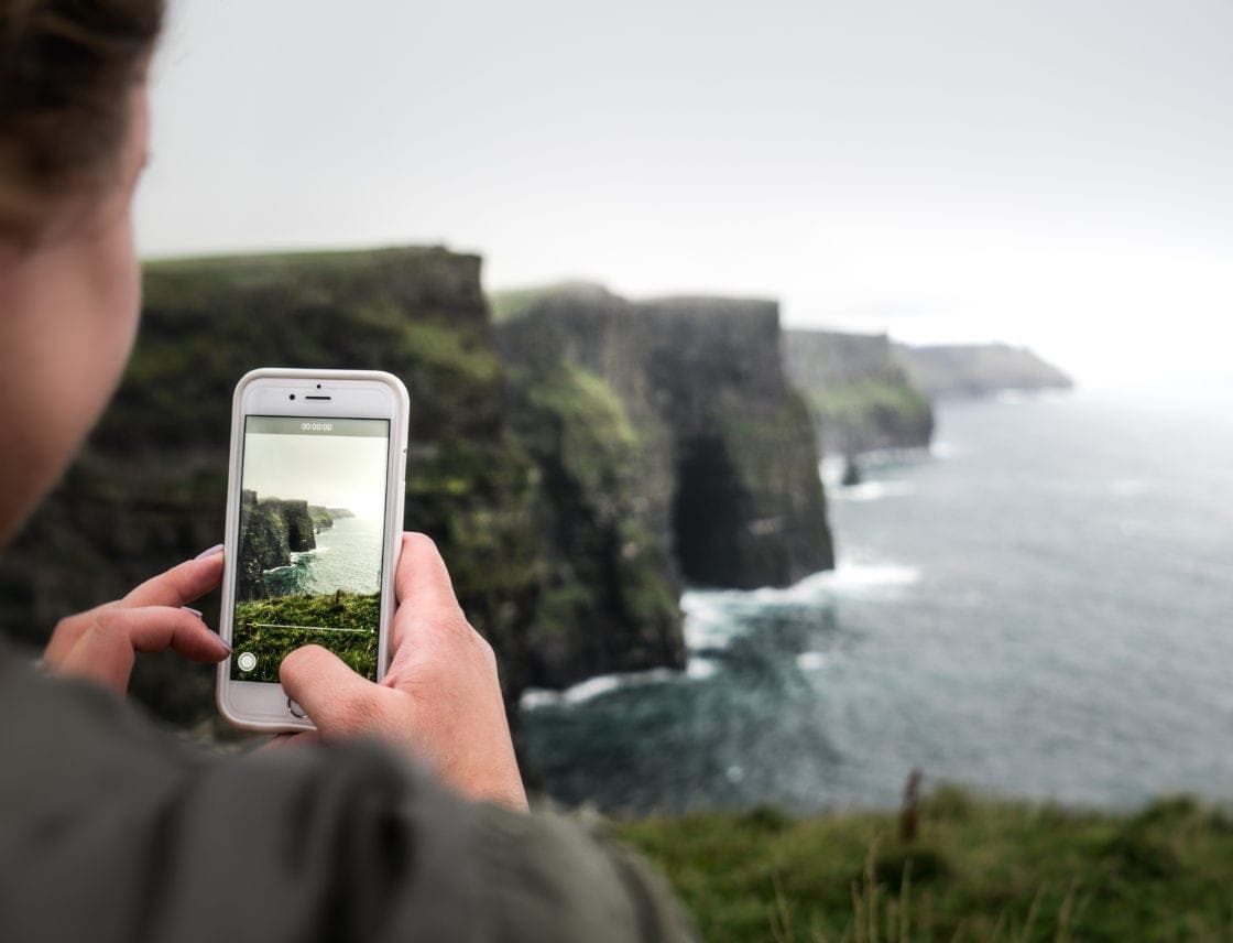 Taking a cell phone photo of the Cliffs of Moher