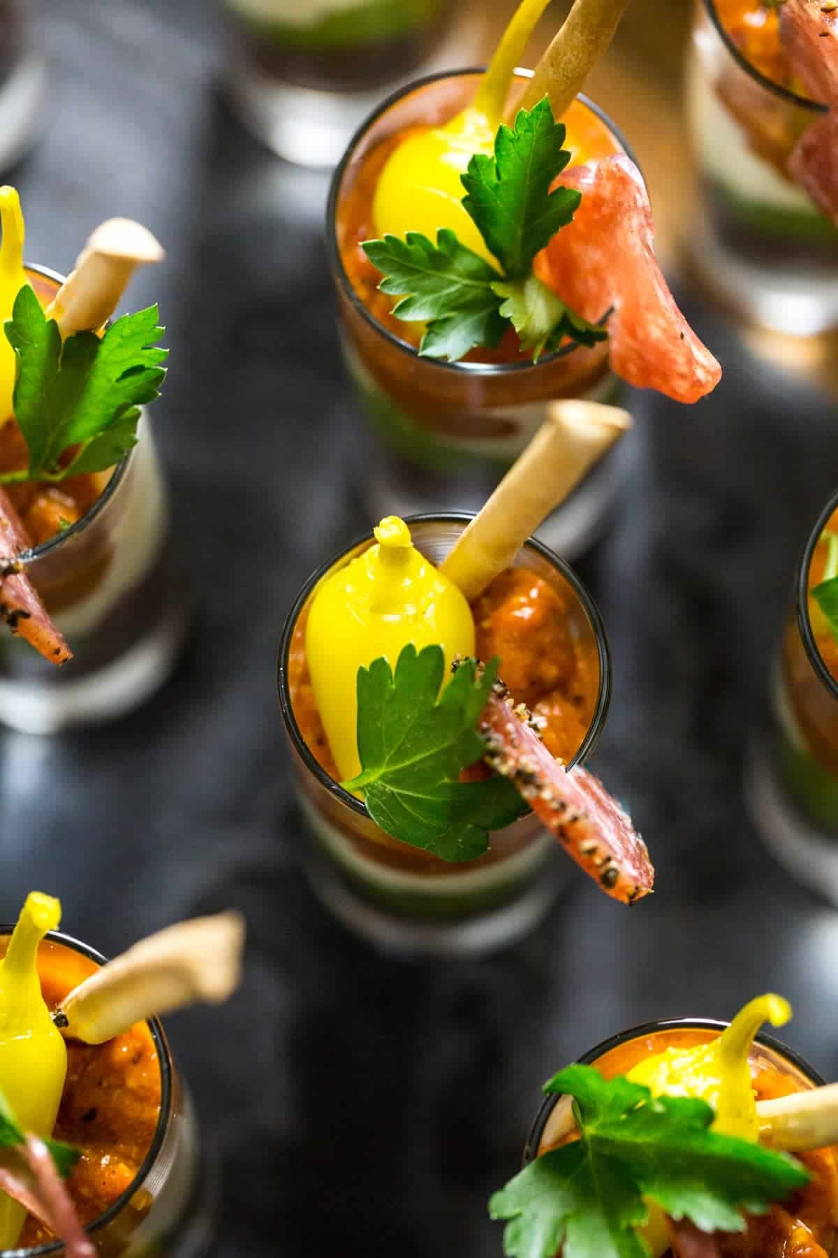 Overhead of Mediterranean Dip Shooters with garnishes
