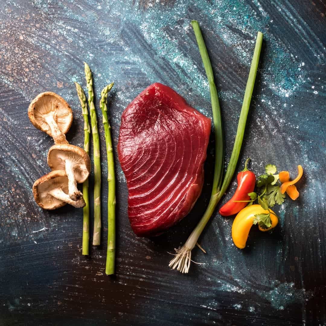 ingredients for poke tacos on slate