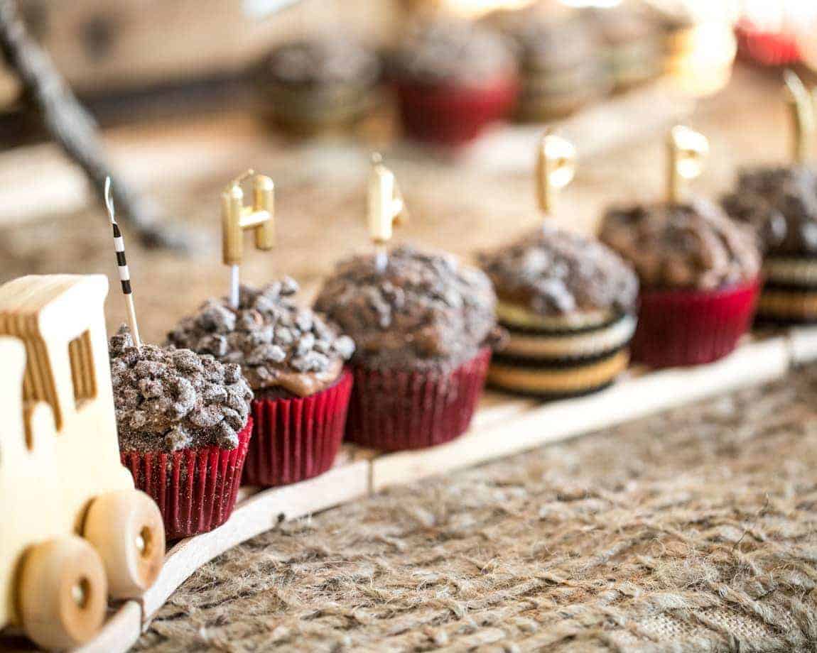 Chocolate Coal cupcakes on wooden train track 