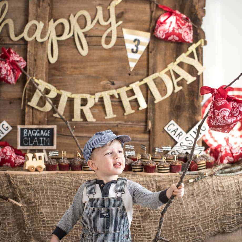 Austin in front of birthday display