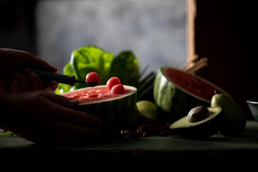 Using a melon baller on the watermelon. 