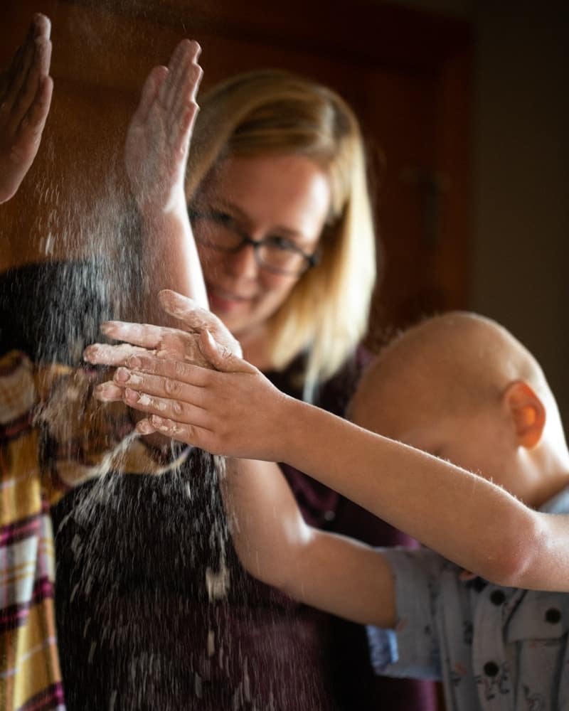 Family Baking and flour flying from hands