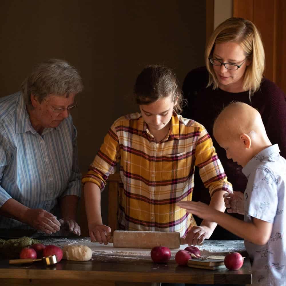 Family Baking together using rolling pin