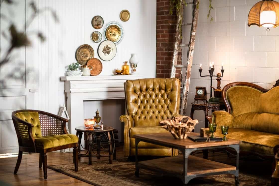 warm inviting client waiting area with beautiful rustic furniture, decor and exposed brick