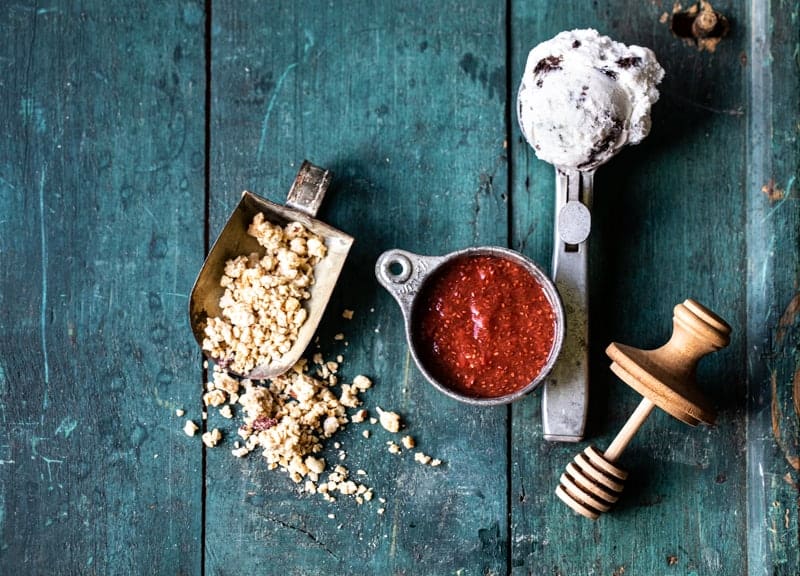 overhead view of ingredients for frozen yogurt sundae. 