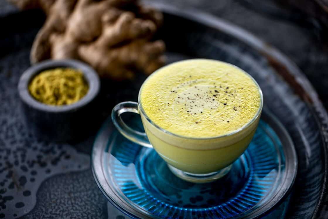3/4 shot of glass teacup of turmeric chai tea