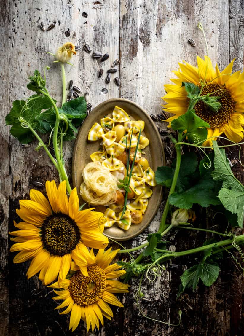 sunflower summer lemon pasta recipe in rustic setting - best food styling