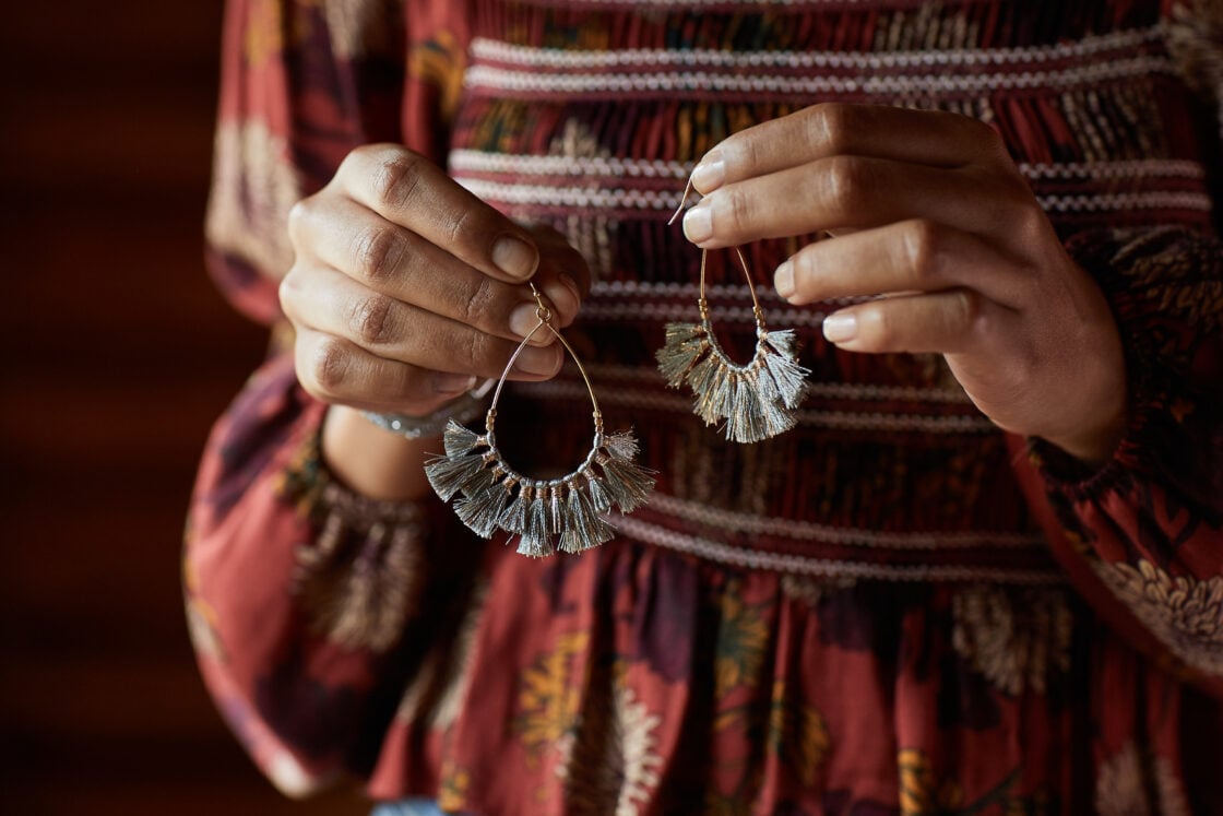 fashion lifestyle photography pair of teardrop fringe earrings 