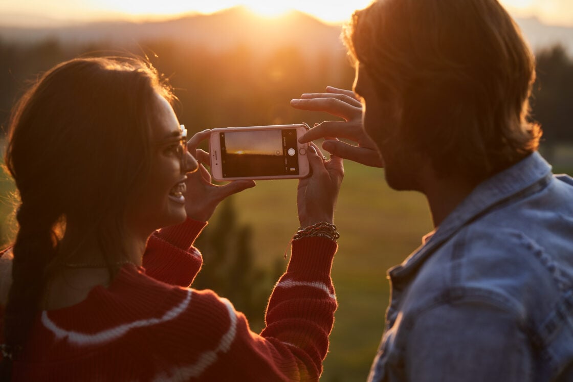 fashion lifestyle photography taking a sunset picture together